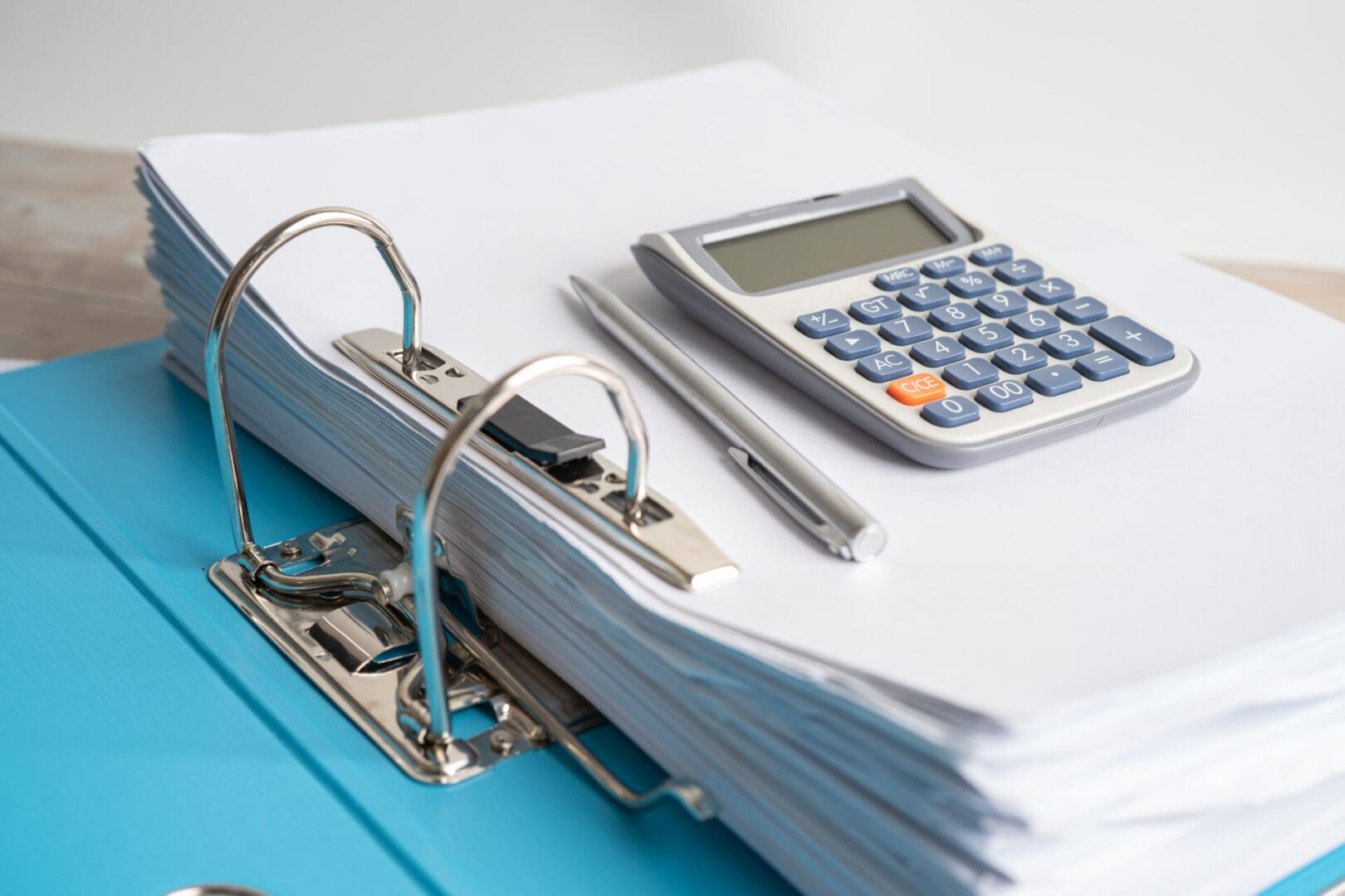 Calculator on finder data finance report business with graph analysis in office.